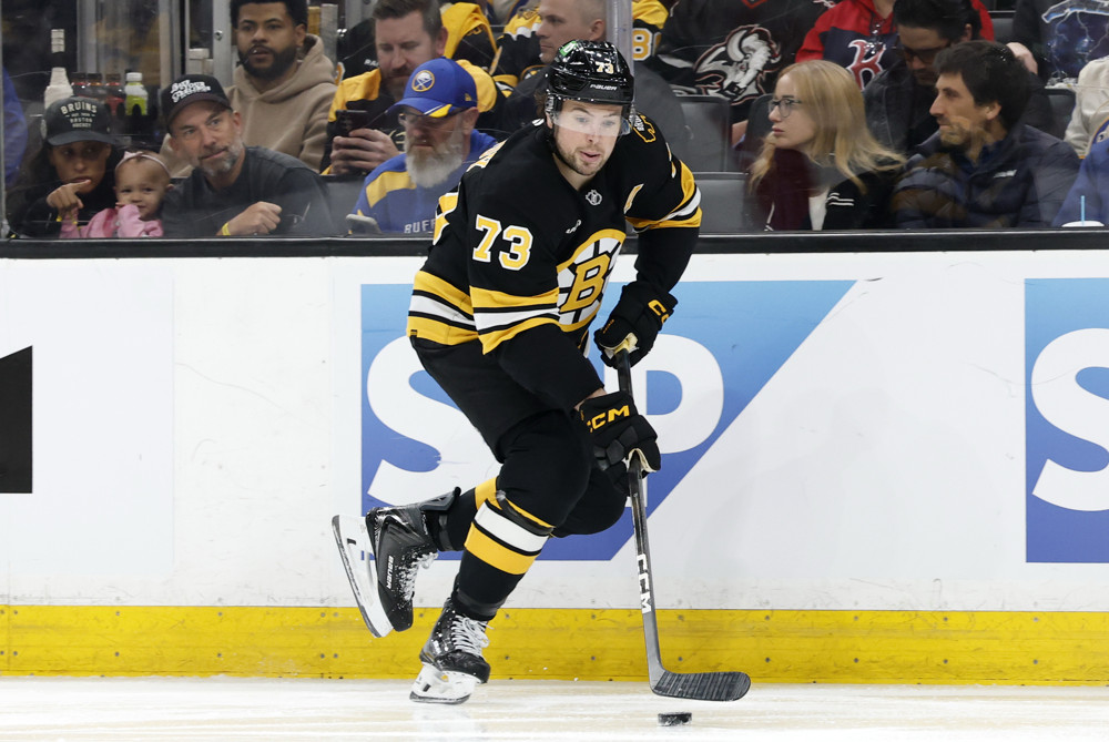 Charlie McAvoy carries the puck up the boards in Game 6 against Buffalo