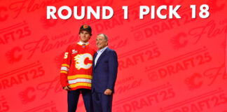 Cole Reschny poses with Gary Bettman after being drafted 18th overall by the Calgary Flames at the 2025 NHL Draft in Los Angeles