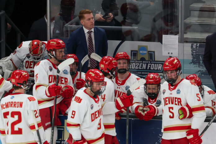 David Carle Denver Pioneers Head Coach NCAA Championship Denver Pioneers head coach David Carle on the bench during the 2026 NCAA Mens Frozen Four championship game vs. Wisconsin