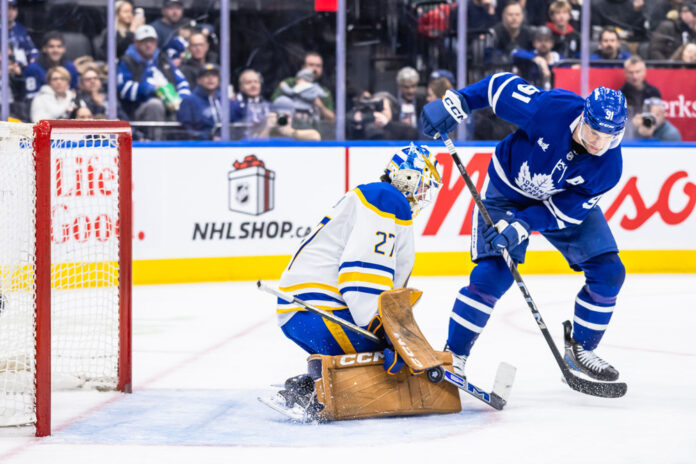 Devon Levi Sabres save Tavares Dec 2024 Buffalo Sabres goaltender Devon Levi makes a save against Toronto Maple Leafs center John Tavares during an NHL game