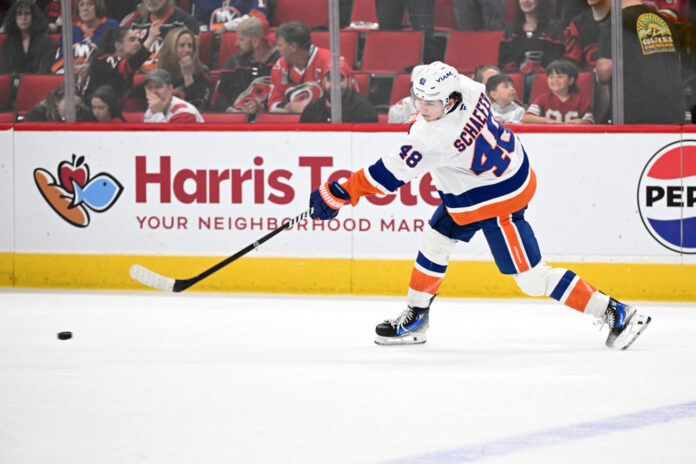 Matthew Schaefer Islanders Calder Trophy New York Islanders defenseman in white road jersey during game action
