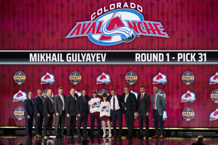 Mikhail Gulyayev Colorado Avalanche 2023 NHL Draft First Round Pick 31 Colorado Avalanche draft pick Mikhail Gulyayev poses with team officials after being selected 31st overall at the 2023 NHL Draft in Nashville