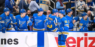 Holloway Signs Five-Year, $38.75M Extension With Blues St. Louis Blues left wing Dylan Holloway celebrates his power play goal with teammates on the bench, NHL game vs Winnipeg Jets, April 9, 2026 at Enterprise Center.