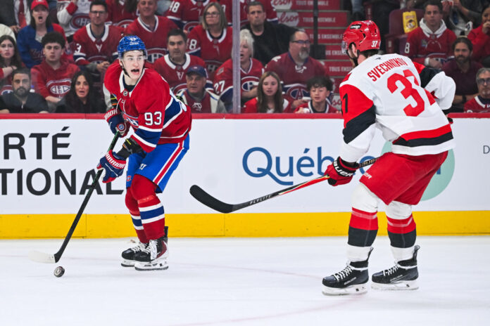 Ivan Demidov Andrei Svechnikov ECF Game 3 2026 Montreal Canadiens forward Ivan Demidov considers his options against Carolina Hurricanes forward Andrei Svechnikov during Game 3 of the 2026 Eastern Conference Final at Bell Centre
