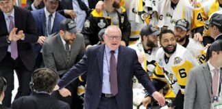 Rutherford to Step Down as Canucks President After 2026 Draft Jim Rutherford speaks at a hockey event