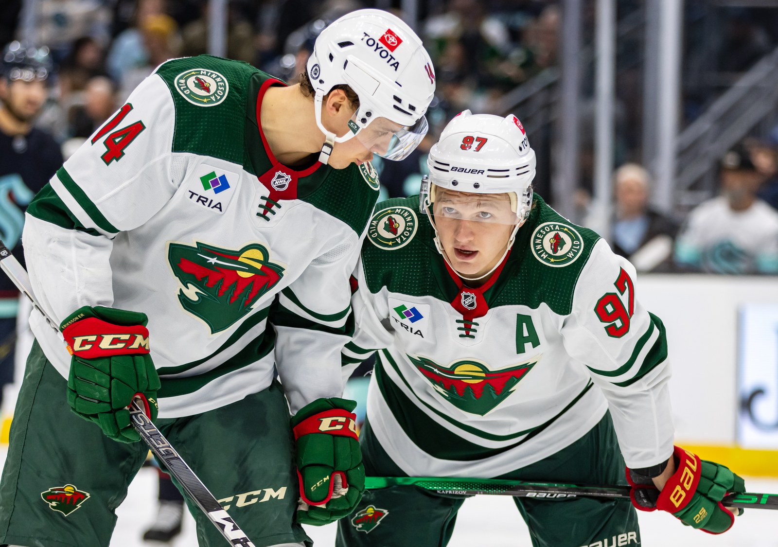Minnesota Wild center Joel Eriksson Ek lines up for a faceoff alongside Kirill Kaprizov