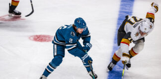 Golden Knights Lose Karlsson to Injury in Game 5 Loss William Karlsson Vegas Golden Knights center battles San Jose Sharks Will Smith for puck NHL game 2025-26 season