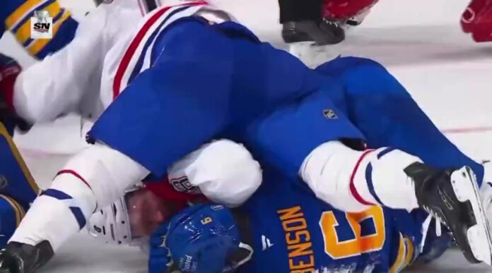 Mike Matheson protects Zach Benson during scrum Mike Matheson lying on top of Zach Benson to shield him from skates during Habs-Sabres Game 2 scrum