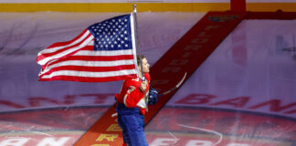 Hughes Brothers, Hellebuyck Lead U.S. All-Star Roster Matthew Tkachuk skates with the USA flag celebrating his Olympic Gold medal at a Florida Panthers game on February 26, 2026
