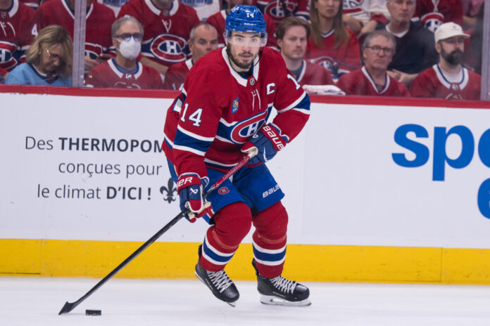 Nick Suzuki Canadiens Game 6 vs Sabres 2026 Montreal Canadiens center Nick Suzuki skates with the puck during the first period of Game 6 of the 2026 Stanley Cup Playoffs second round against the Buffalo Sabres at Bell Centre