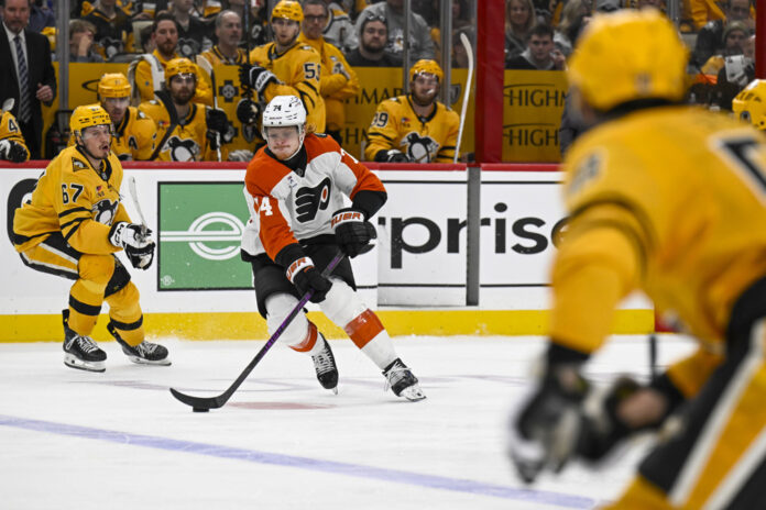 Owen Tippett Flyers vs Penguins Game 5 April 27 2026 Philadelphia Flyers right wing Owen Tippett skates with the puck against Pittsburgh Penguins right wing Rickard Rakell during Game 5 of the 2026 Stanley Cup Playoffs First Round at PPG Paints Arena