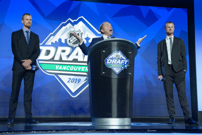 Henrik Sedin and Daniel Sedin at 2019 NHL Draft Henrik Sedin and Daniel Sedin on stage with NHL Commissioner Gary Bettman at the 2019 NHL Draft in Vancouver