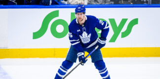 Maple Leafs Trade Brandon Carlo to Blues for Two Picks Toronto Maple Leafs defenseman Brandon Carlo skates with the puck before being traded to the St. Louis Blues