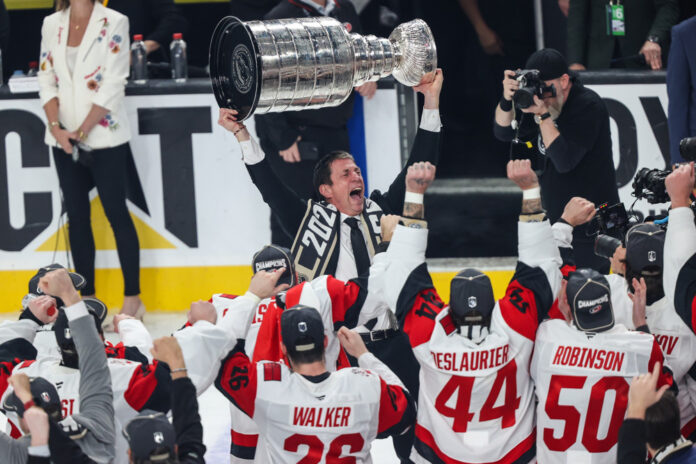 NHL: JUN 14 Stanley Cup Final Hurricanes at Golden Knights Carolina Hurricanes head coach Rod Brindamour hoists the Stanley Cup after Game 6 of the 2026 Final