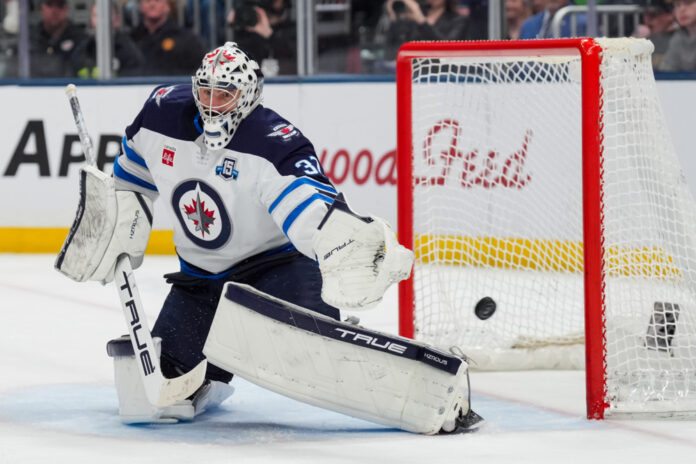 NHL: APR 04 Jets at Blue Jackets Connor Hellebuyck Winnipeg Jets goalie makes a save amid NHL trade rumors