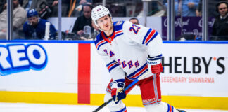 Drury Says Rangers Are Younger, Faster After Retool New York Rangers defenseman Adam Fox skates with the puck