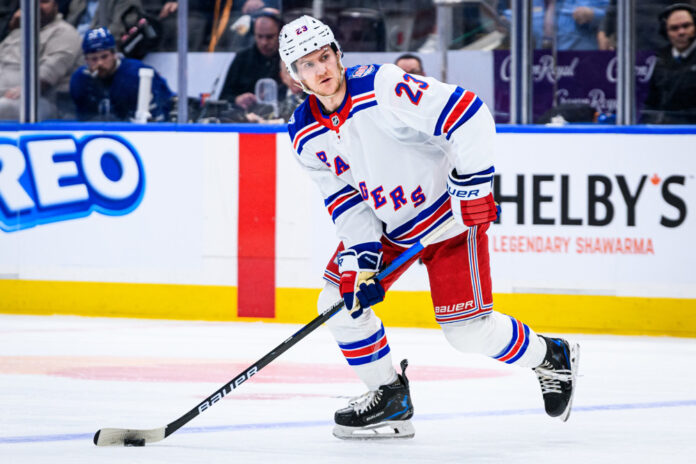 NHL: MAR 25 Rangers at Maple Leafs New York Rangers defenseman Adam Fox skates with the puck