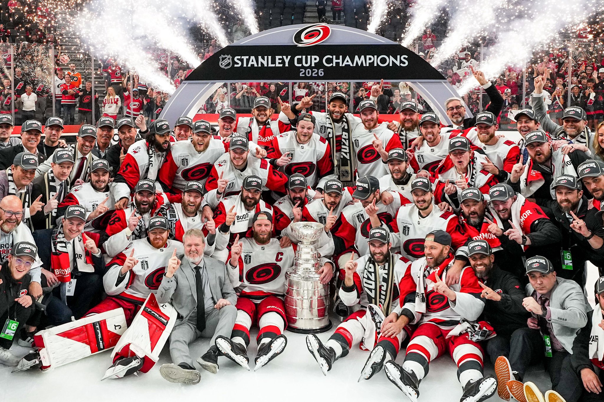 The Carolina Hurricanes pose with the Stanley Cup after winning the 2026 Final over the Vegas Golden Knights