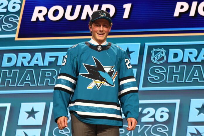 Ivar Stenberg Sharks 2026 NHL Draft second overall pick Ivar Stenberg smiles in a San Jose Sharks jersey after being selected second overall in the 2026 NHL Draft