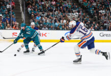 Dickinson Injury Setback Threatens Oilers’ Opener Edmonton Oilers center Jason Dickinson shoots the puck during an NHL game against the San Jose Sharks