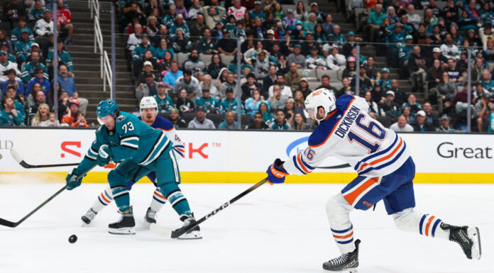 Dickinson Injury Setback Threatens Oilers’ Opener Edmonton Oilers center Jason Dickinson shoots the puck during an NHL game against the San Jose Sharks