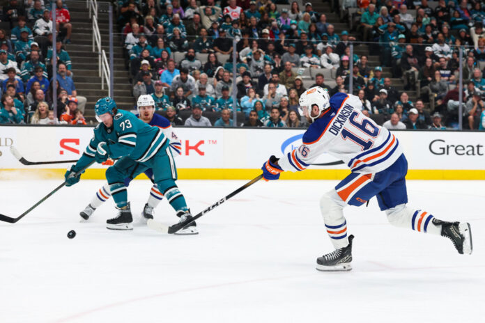 Jason Dickinson Edmonton Oilers Edmonton Oilers center Jason Dickinson shoots the puck during an NHL game against the San Jose Sharks