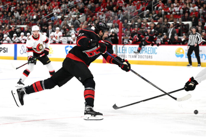 NHL: FEB 03 Senators at Hurricanes Jesperi Kotkaniemi Carolina Hurricanes center shoots the puck NHL trade buyout