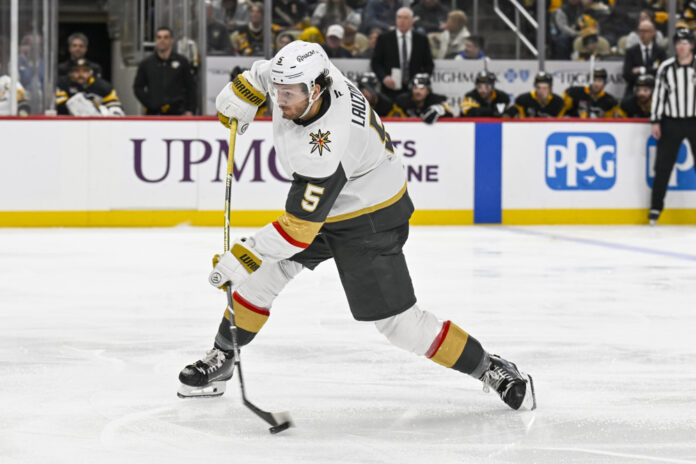Jeremy Lauzon Vegas Golden Knights shoots puck Pittsburgh 2026 Vegas Golden Knights defenseman Jeremy Lauzon shoots the puck during the third period at PPG Paints Arena in Pittsburgh on March 1 2026