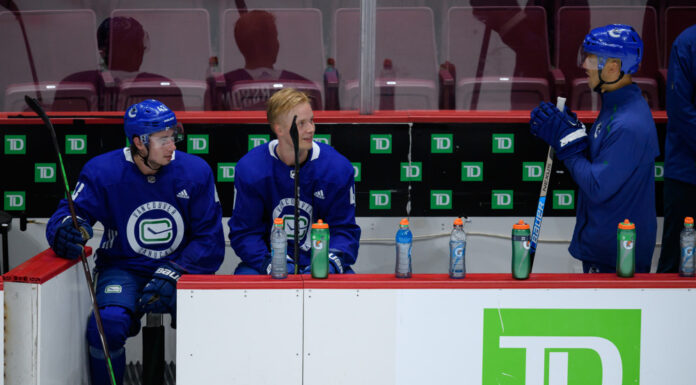 Malhotra Bag Skate: Canucks Coach Outskated His Own Players Vancouver Canucks head coach Manny Malhotra with Quinn Hughes and Elias Pettersson at training camp