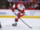 Alexander Nikishin Carolina Hurricanes defenseman controls the puck
