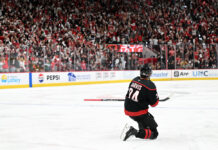 Seth Jarvis Carolina Hurricanes celebrates toward the crowd after scoring overtime winner Game 2 Stanley Cup Final Lenovo Center Raleigh