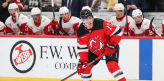 Simon Nemec New Jersey Devils defenseman skates puck Calgary Flames trade 2026
