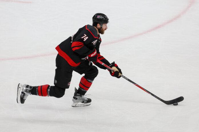 Jaccob Slavin carries puck Game 1 Stanley Cup Final 2026 Jaccob Slavin Carolina Hurricanes defenseman Stanley Cup Final