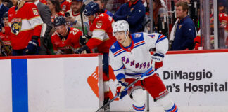 Rangers Re-Sign Braden Schneider, Avoid Arbitration New York Rangers defenseman Braden Schneider skates with the puck