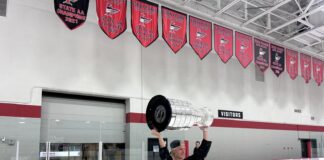Jackson Blake Stanley Cup Day Draws 1,300 in Eden Prairie Jackson Blake hoists the Stanley Cup at Eden Prairie Community Center under the Eagles state championship banners
