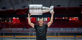 Kotkaniemi Brings Stanley Cup Home to Pori for 2,000 Fans Jesperi Kotkaniemi lifts the Stanley Cup at center ice in Pori Finland Enersense Areena Carolina Hurricanes 2026 champion