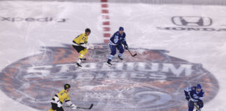 NHL National TV Games by Team: Canucks, Flames at Zero Players skate over the center ice logo at the NHL Stadium Series