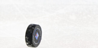 NHL Preseason Schedule: 65 Games Crammed Into Eight Days Official NHL puck standing on the ice