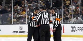 NHL Rule Changes: Players Want the Offside Review Gone NHL officials gather on the ice during a game
