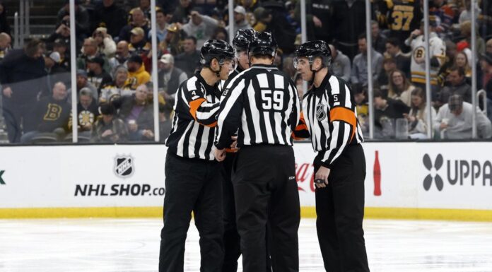 NHL Rule Changes: Players Want the Offside Review Gone NHL officials gather on the ice during a game