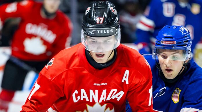 Hockey Canada, Canada Push Back on Russia’s IIHF Return Team Canada forward battles a United States player at the 2026 World Junior Summer Showcase in Windsor ahead of the 2027 World Junior Championship in Edmonton
