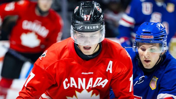 canada-world-juniors-2027-roster-projection Team Canada forward battles a United States player at the 2026 World Junior Summer Showcase in Windsor ahead of the 2027 World Junior Championship in Edmonton