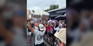 Jalen Chatfield Stanley Cup Day: Hoisting It in the Rain Jalen Chatfield hoists the Stanley Cup for Carolina Hurricanes fans during his day with the trophy in North Carolina