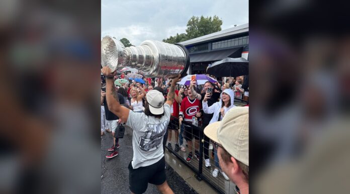 Jalen Chatfield Stanley Cup Day: Hoisting It in the Rain Jalen Chatfield hoists the Stanley Cup for Carolina Hurricanes fans during his day with the trophy in North Carolina