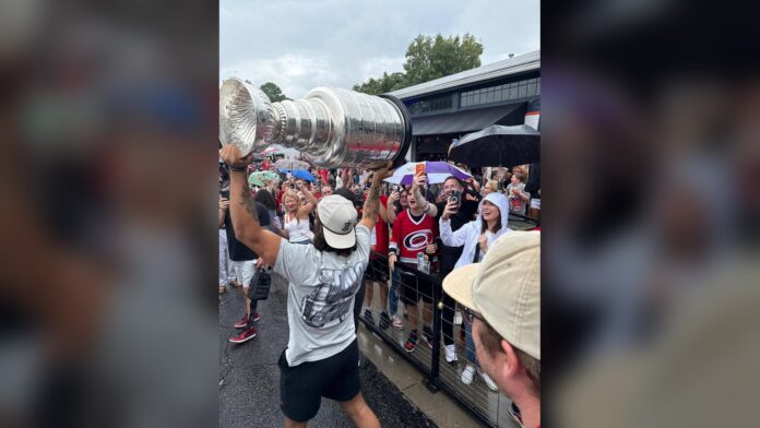 Jalen Chatfield Stanley Cup Day 2026 Hurricanes Jalen Chatfield hoists the Stanley Cup for Carolina Hurricanes fans during his day with the trophy in North Carolina