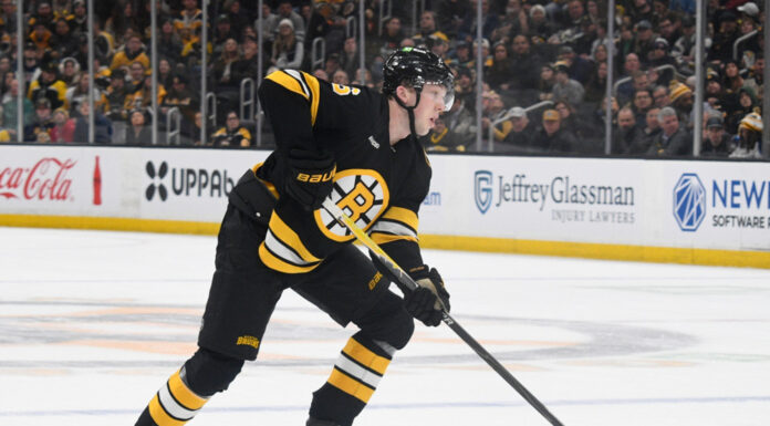 Mason Lohrei Trade Talk: ‘You’ve Got to Earn Your Spot’ Mason Lohrei Boston Bruins defenseman skates with the puck at TD Garden during the 2025-26 NHL season