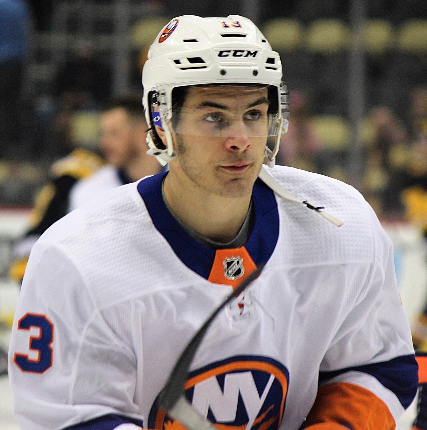 Close portrait of Mathew Barzal in an Islanders white jersey during warmups in 2018