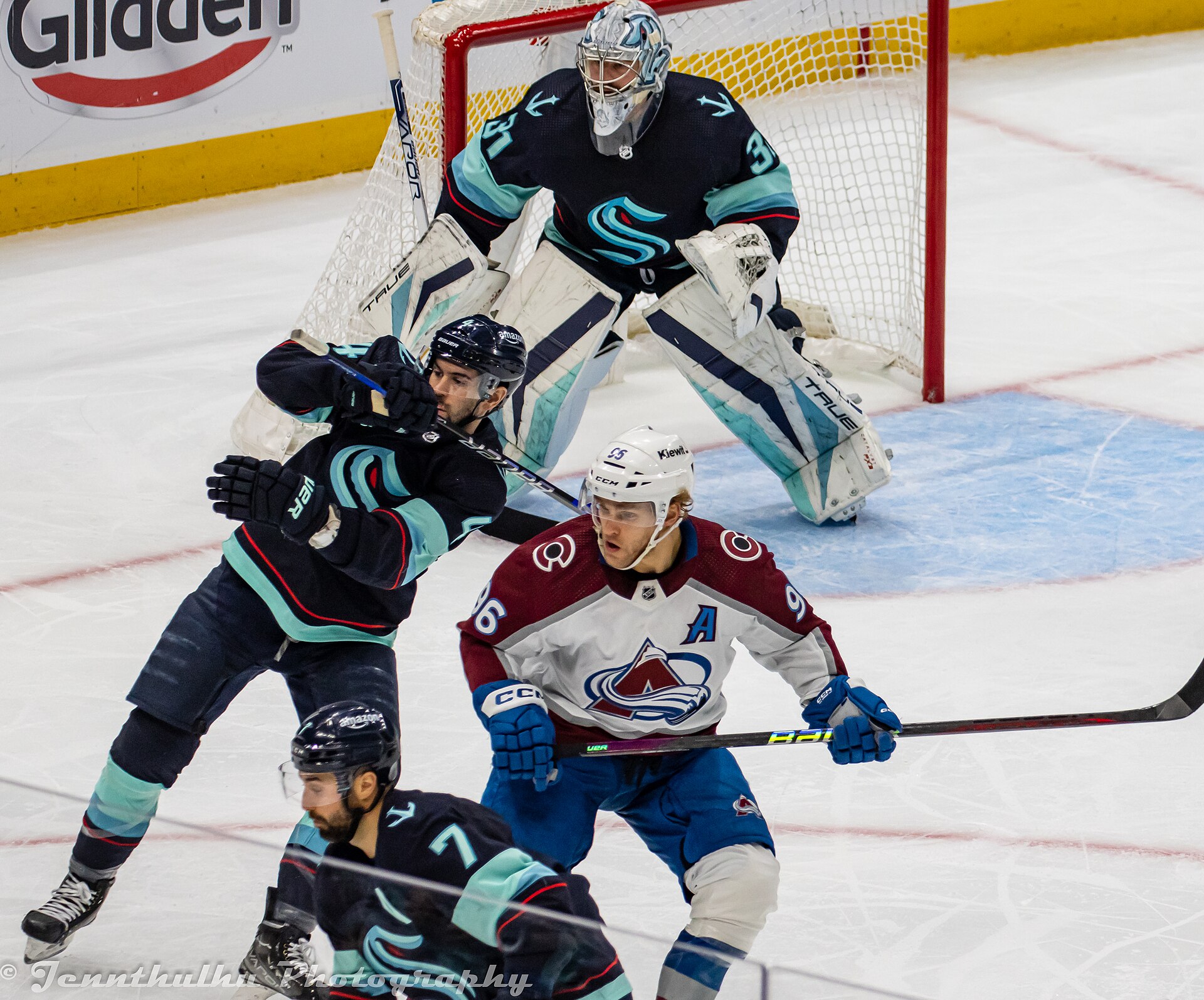 Mikko Rantanen in front of the Seattle net in a white Colorado Avalanche sweater