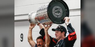 Stanley Cup Day: Eric Robinson Hands It to Guy Gaudreau Eric Robinson and Guy Gaudreau raise the Stanley Cup together at Hollydell Ice Arena in Sewell, New Jersey