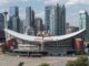 Flames Saddledome Patch: Every Jersey Gets 1983 and 2027 Scotiabank Saddledome exterior with the Calgary skyline behind it as the Flames begin their Dome farewell season